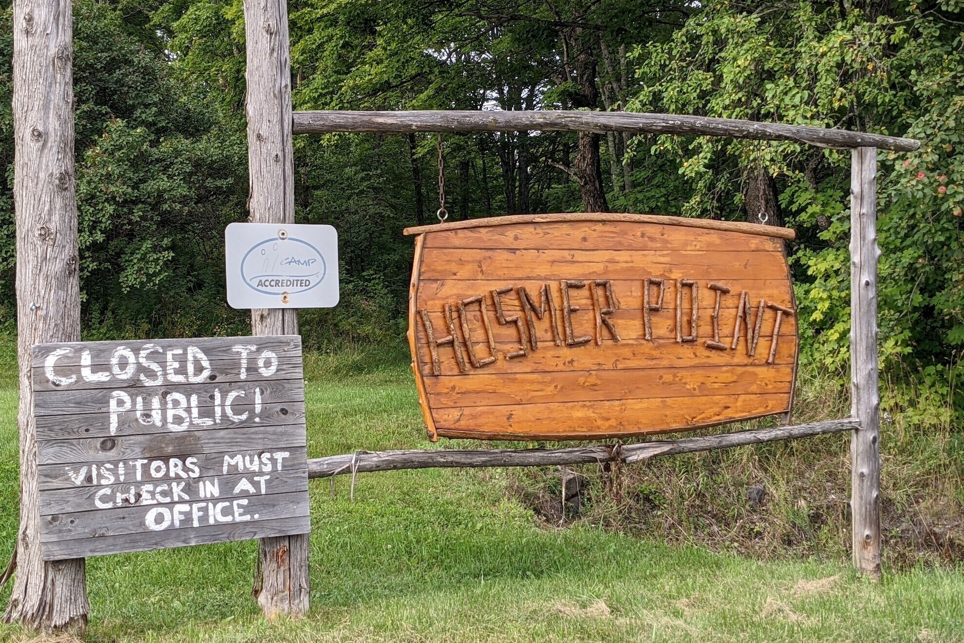 Hosmer Pond sign held up on wooden posts