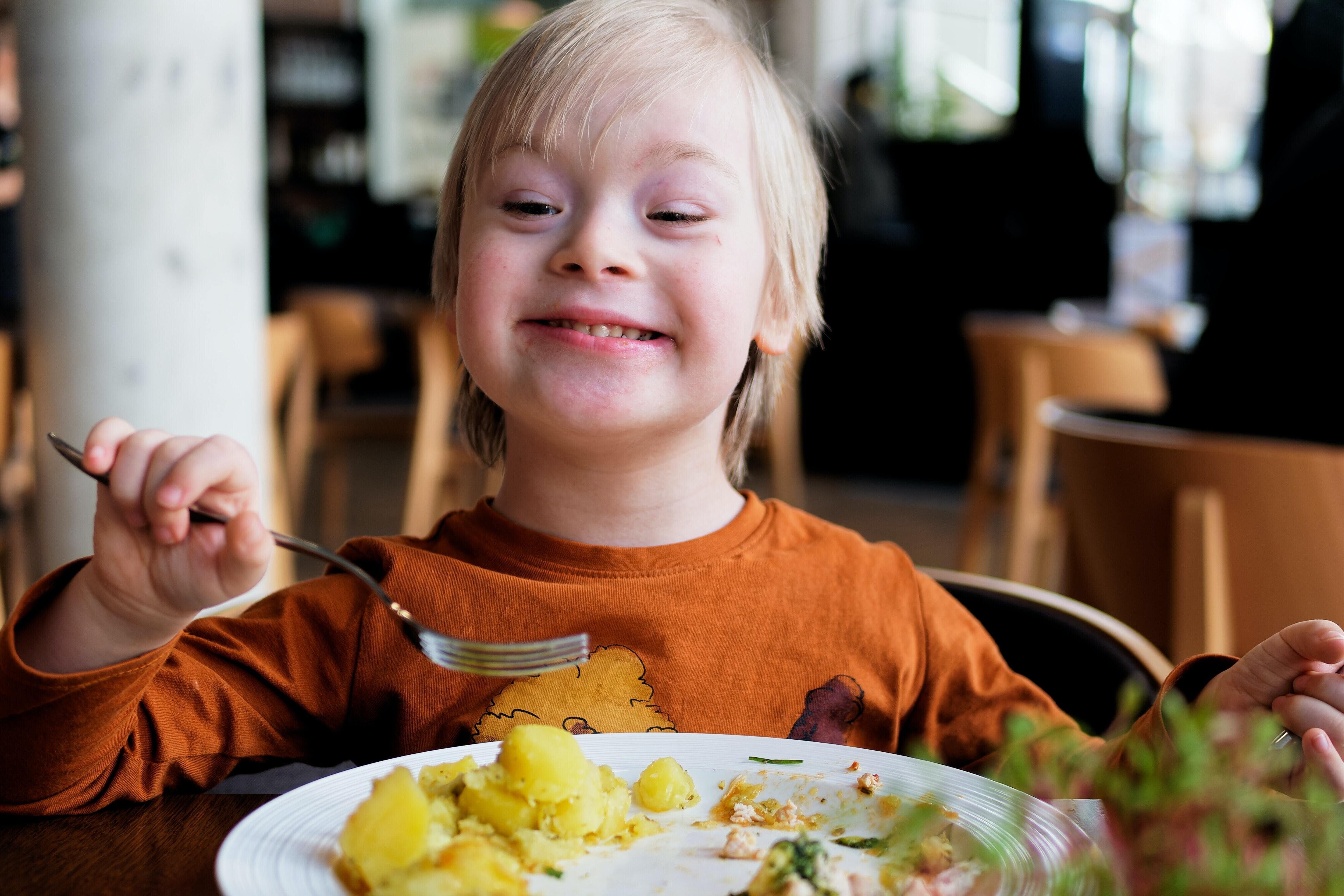 Happy child eating food