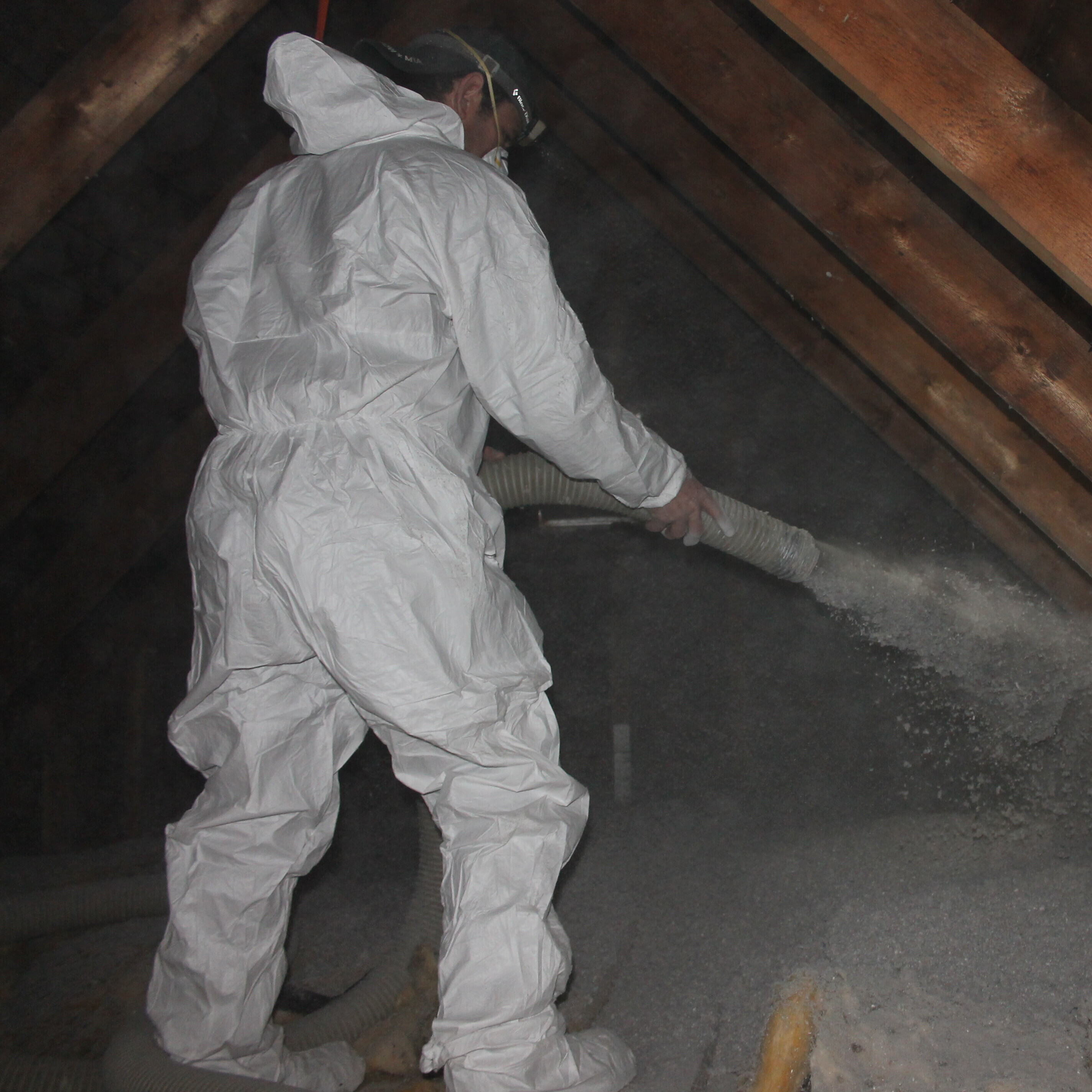 Person insulating attic