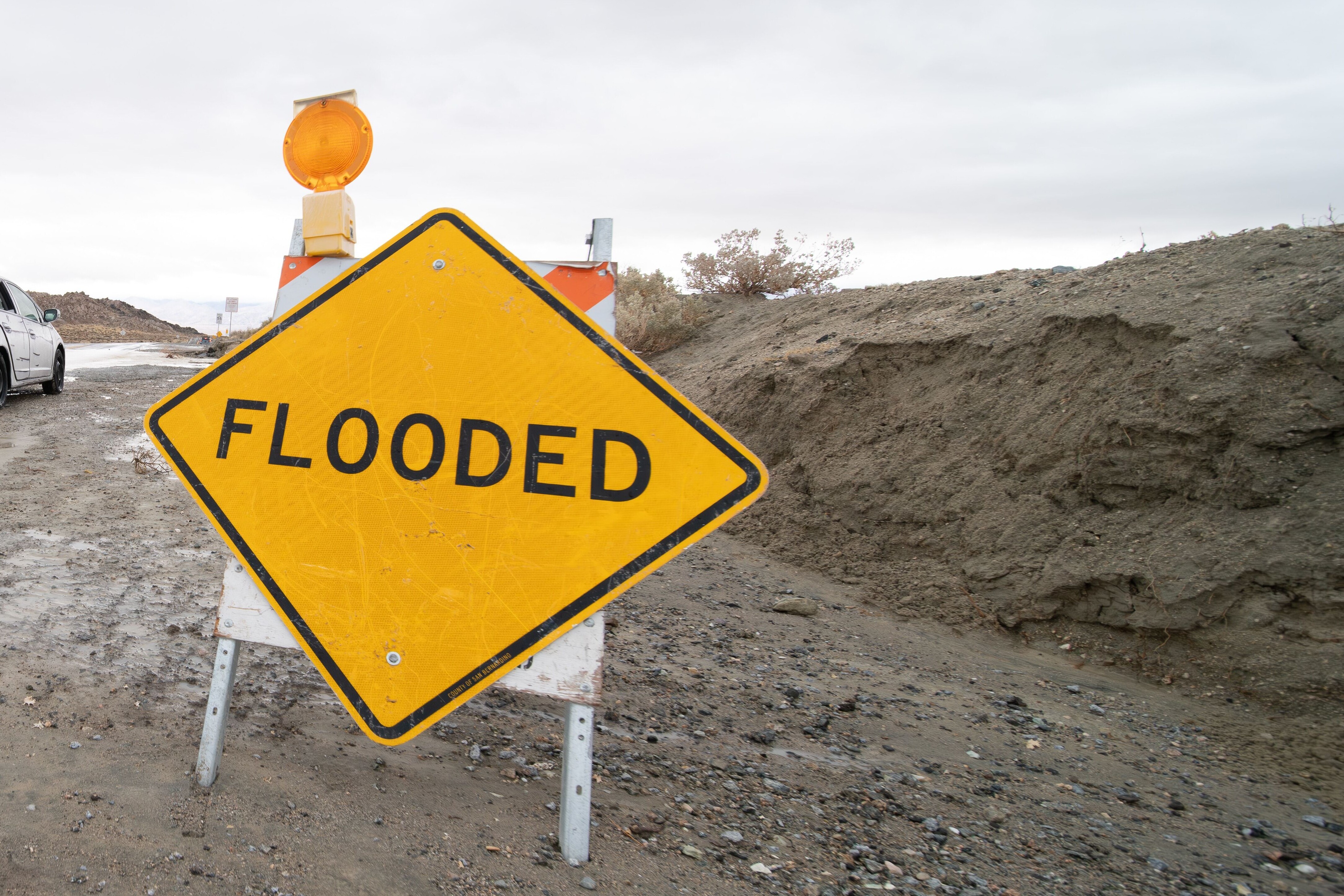 Road sign warning of flooded area