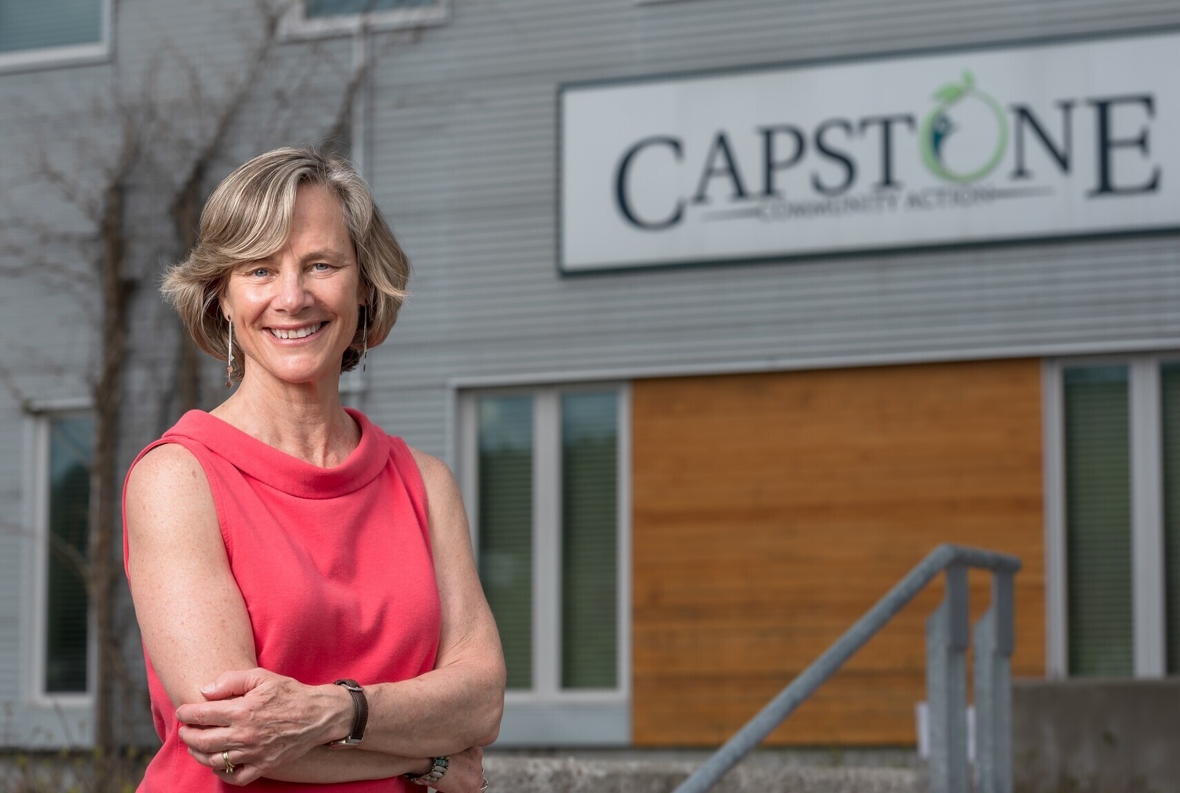 Sue Minter poses in front of Capstone's Gable Place office in Barre